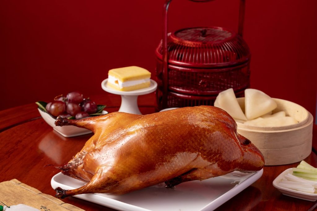Chef arranging dishes on a tray